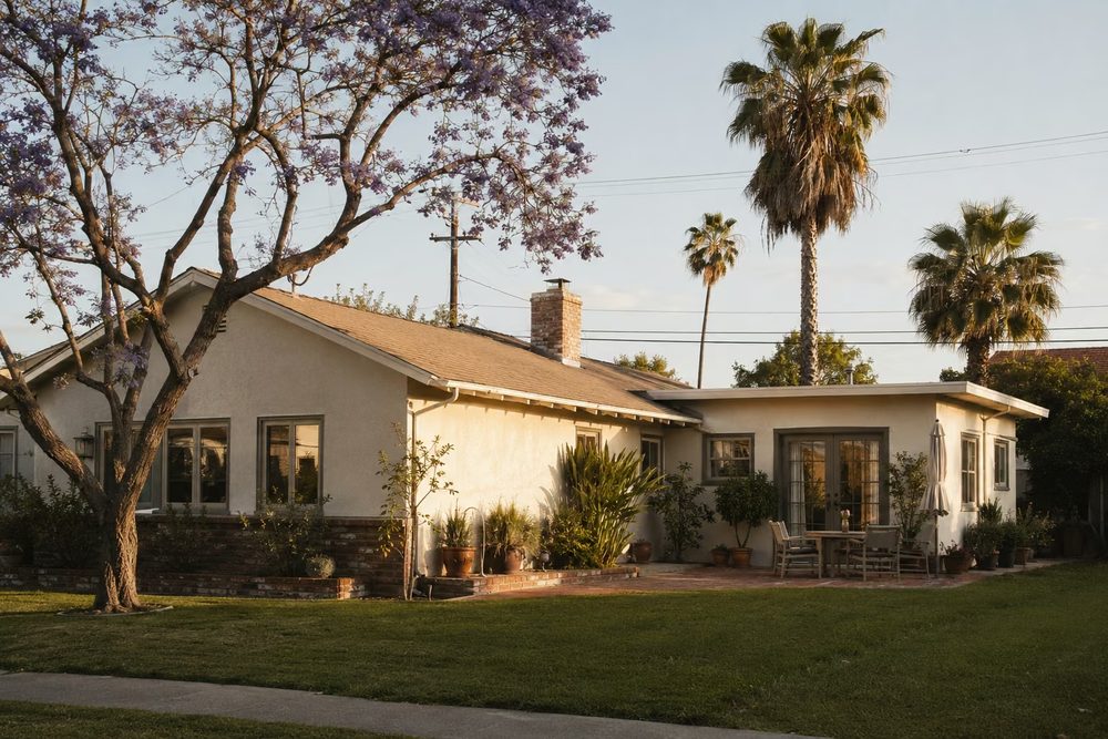 Post-war stucco home with a room addition on a North Hollywood street